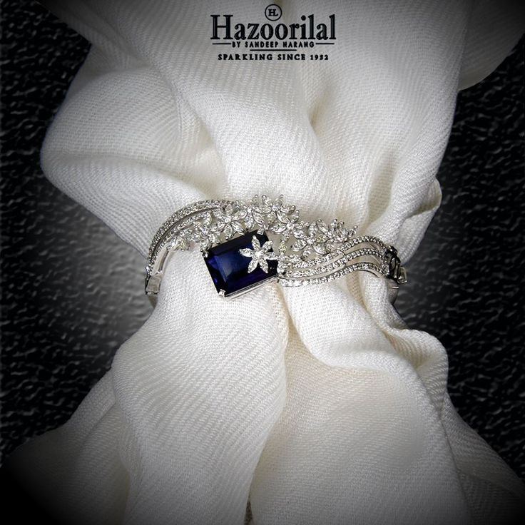 Tanzanite encapsulated by the diamonds make this magnificently exquisite bracele...