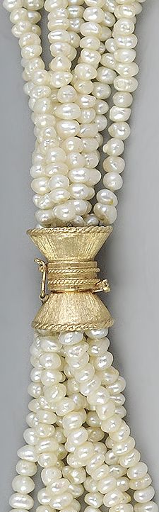 Torsade-style pearl 14K gold necklace.