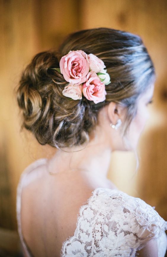 Featured Photographer: Matt McElligott; Elegant updo wedding hairstyle with pink...