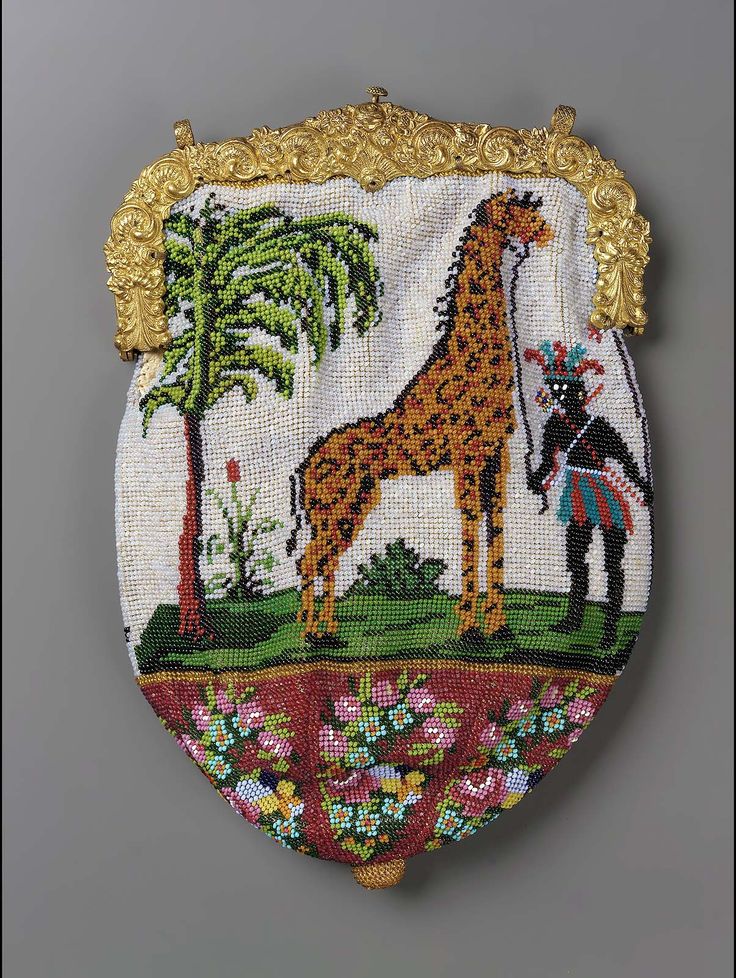 Polychrome glass beaded bag with a picture on each sides. One depicts a giraffe,...