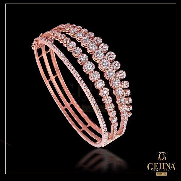 A Beguiling Charm!⠀ This pair of #RoseGold and #Diamond #Bracelet is designed ...