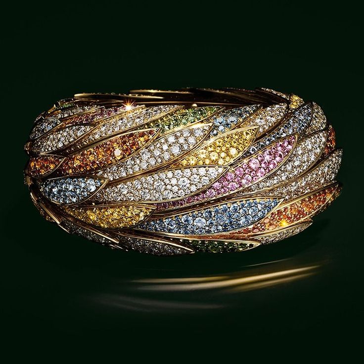 Bracelet in 18k gold with fancy sapphires, tsavorites, spessartites and diamonds...