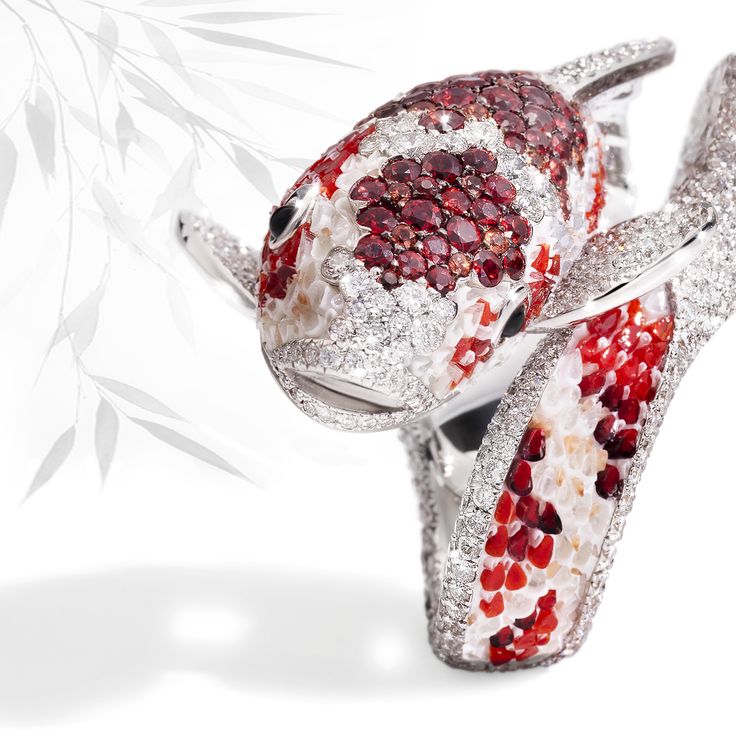 The sinuosity of its body and the brightness of its scales make of our Koi ring ...