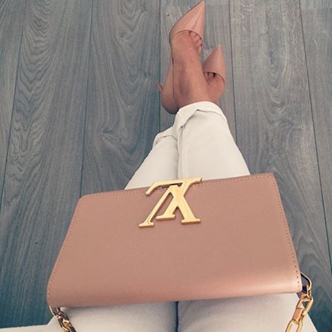 Chic Louis Vuitton cross-body paired with classic Christian Louboutin's