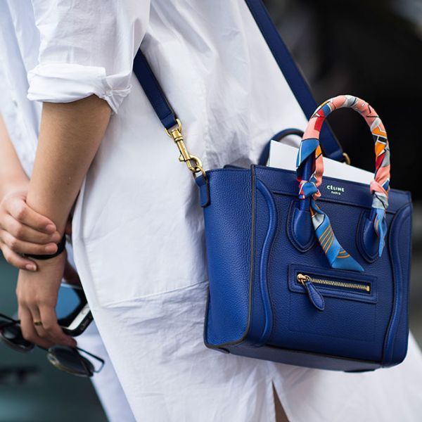 Love the idea of tying a scarf around the bag handle! How To Dress Like A French...