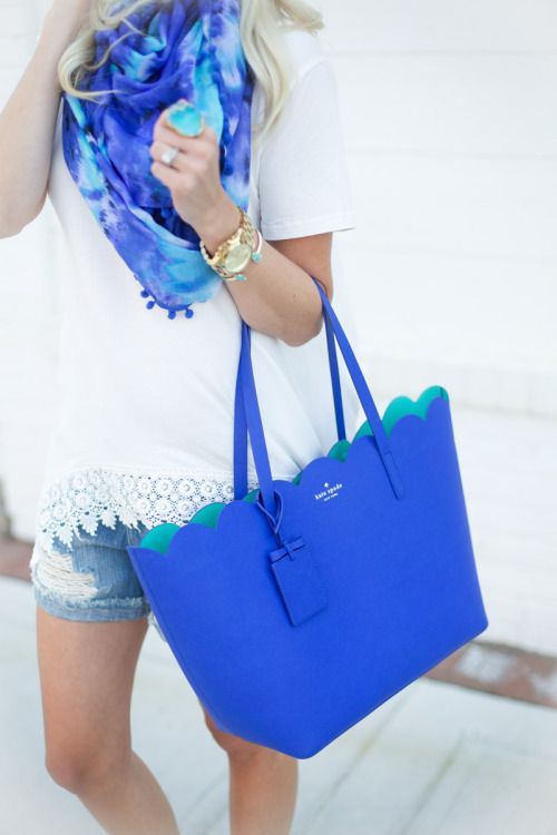 White Top, Light Wash Jean Shorts, Blue Purse, Blue Scarf, Gold Accessories.