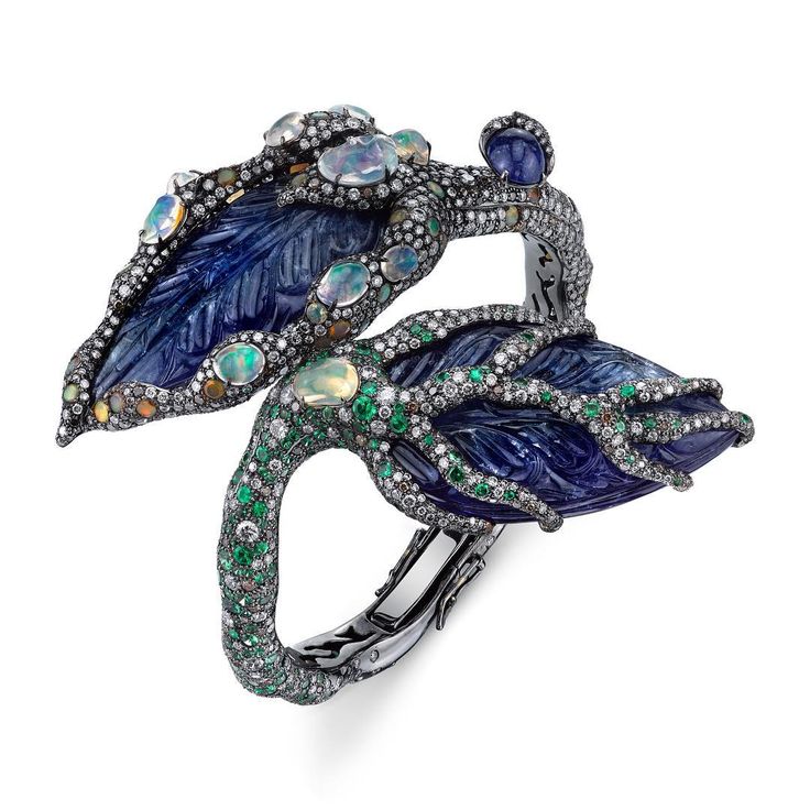 Arunashi cuff with hand sculpted Tanzanite and Opal details. #visitcarmel #pebbl...