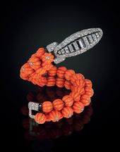 An Art Deco coral, diamond and onyx bracelet, by Cartier.