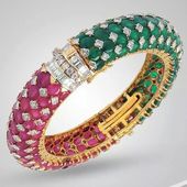 Gorgeous bracelet studded with rubies, emeralds and diamonds