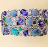 Cellini 's Opal Bracelet accented with Tanzanite , emeralds , and Diamonds on wh...
