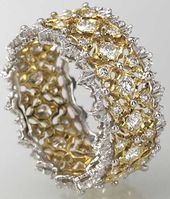 white gold, yellow gold, and diamond Buccellati ring.