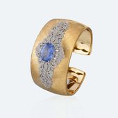 Dream 9 Yellow and white gold with sapphire and diamonds Materials: Yellow Gold,...