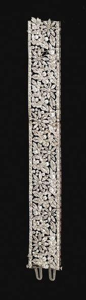 DIAMOND BRACELET, FRENCH, CIRCA 1915. The articulated open work band decorated w...