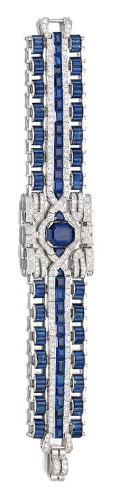 SAPPHIRE AND DIAMOND BRACELET, CIRCA 1965. The wide open work band set at the ce...