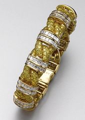 YELLOW DIAMOND AND DIAMOND BRACELET, GRAFF. Designed as a braid, pavé-set with ...