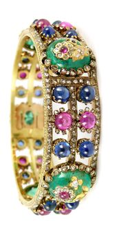 Emerald, ruby, sapphire, diamond and gold bracelet.